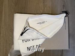 Golden Goose Ball Star in French is 'Étoile de basket Golden Goose'.