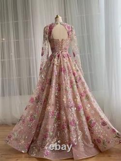 Robe de soirée en tulle rose luxueux avec broderies florales et sequins, à manches longues pour le bal
